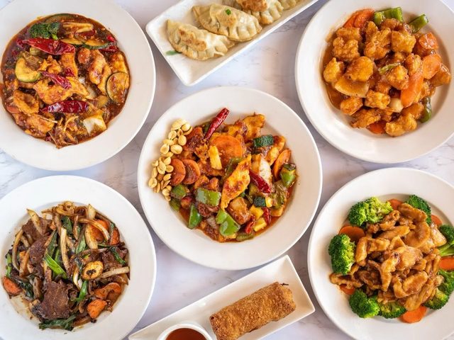 A family-style spread of Autumn Court catering trays for a Phoenix group